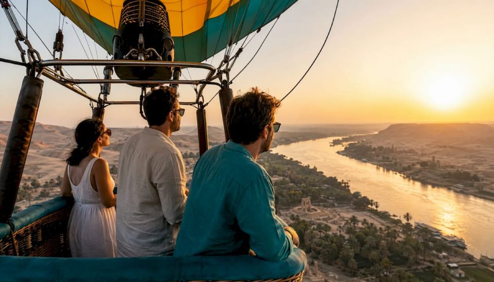 Tourists enjoying scenic Luxor balloon ride at sunrise