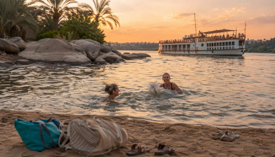 Travelers swimming at Nile river sandbank stop