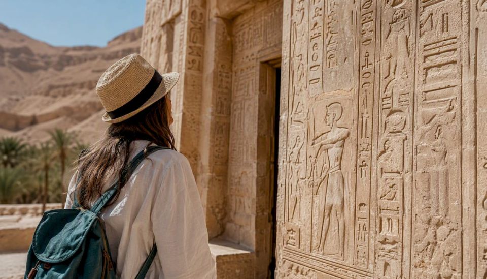 Tourist exploring Valley of the Kings tomb entrance