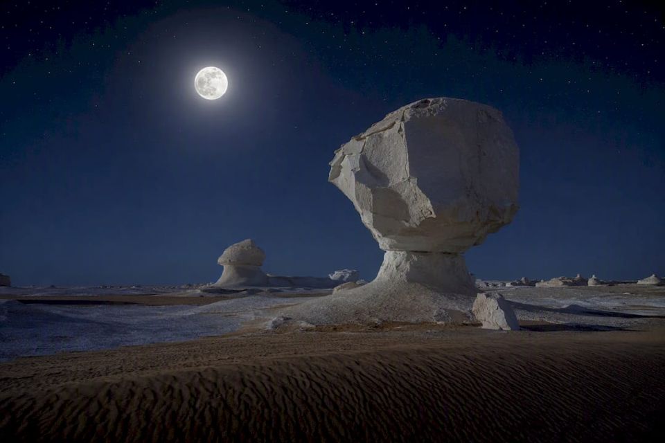 White Desert chalk formations under starry sky